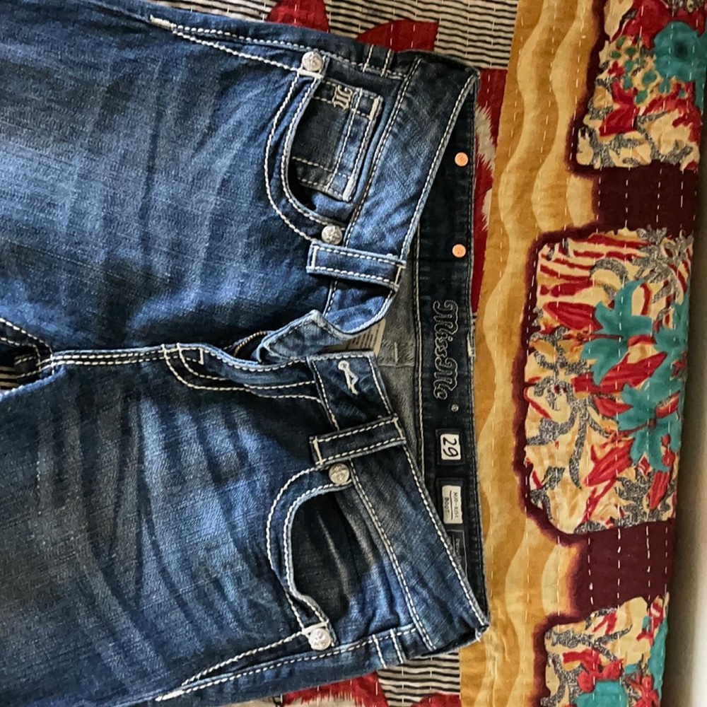 Size 29 Miss Me mid rise bootcut jeans. Only worn two times. Great condition.